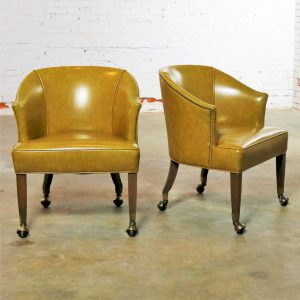 Pair of Mid Century Naugahyde Olive Green Rolling Barrel Chairs with Nail Head Accent